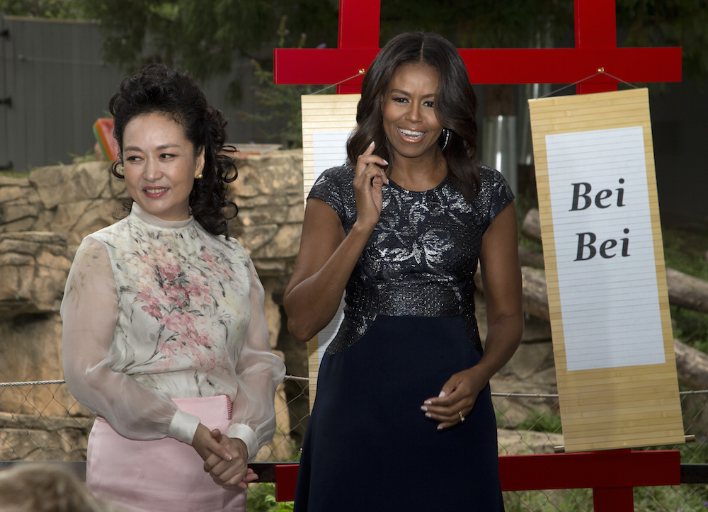 First lady Michelle Obama and China’s first lady Peng Liyuan, reveal the name of the panda born at the Smithsonian’s National Zoo in Washington on Aug. 22 to Mei Xiang, during a visit to the zoo in Washington, Friday, Sept. 25, 2015. The name is Bei Bei, which means “precious treasure.” It was chosen by both the Chinese and American first ladies. (AP Photo/Manuel Balce Ceneta)